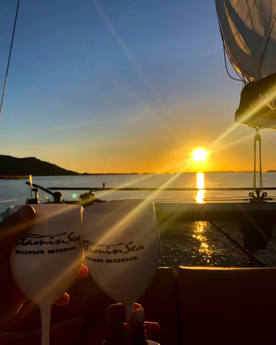 Sunset on a luxury catamaran in Bora Bora