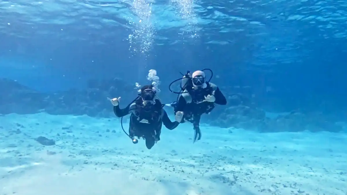 Couple on a romantic dive in the Bora Bora lagoon